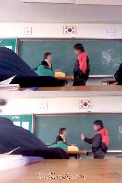 A screen capture of a video that surfaced last week shows a student (right) rebelling against his teacher after he was told to be quiet.