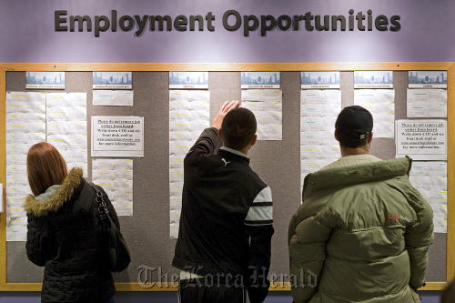 Job seekers look at job listings at the Denver Workforce Center, part of the Denver Office of Economic Development, Colorado. (Bloomberg)