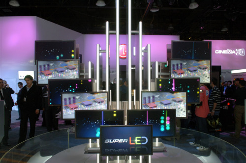 Visitors look at LG Electronics’ latest monitors at the Consumer Electronics Show in Las Vegas on Saturday. (LG Electronics)