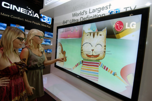 Product demonstrators watch LG Electronics’ 3-D television at this year’s Consumer Electronics Show in Las Vegas. (LG Electronics)