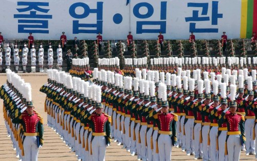 Army Academy cadets salute during their commission ceremony. (The Korea Herald)