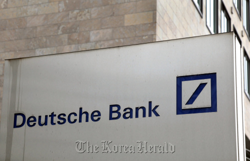 A Deutsche Bank AG logo is seen on one of the bank’s branches in Frankfurt, Germany. (Bloomberg)