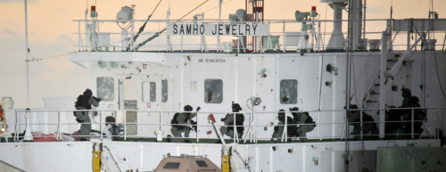 South Korean naval forces storm the steering room of the Samho Jewelry in the Indian Ocean on Friday. (Navy)