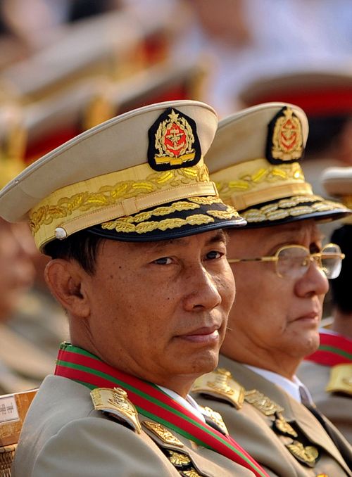 Myanmar general Thura Shwe Mann (left) and prime minister Thein Sein (right) attending a military parade marking the country’s 65th Armed Forces day at a parade ground in the new capital Naypyidaw. (AFP-Yonhap News)