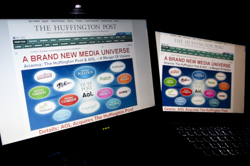 The homepage of the Huffington Post displayed on laptop computers in Washington, D.C. (Bloomberg)