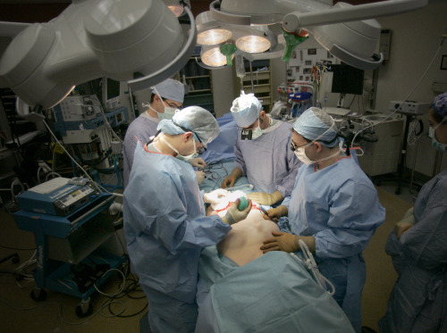Surgeons operate on a breast cancer patient in a hospotal in Wisconsin. (MCT)