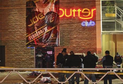 State police stand outside of a nightclub after gunmen opened fire and hurled a grenade in the western city of Guadalajara, Mexico, early Saturday, Feb. 12, 2011. Six people were killed and at least 37 were injured. (AP Photo)