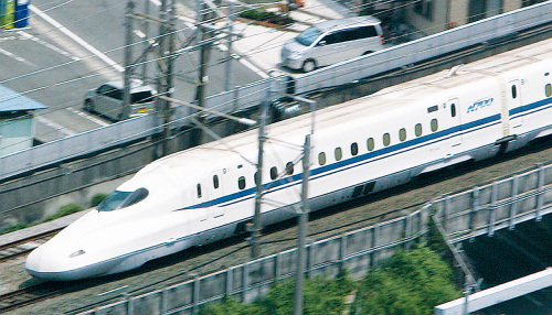 The new N700 series Shinkansen train rounds a bend in Iwata, Shizuoka Prefecture, Japan, June 7, 2006. (MCT)