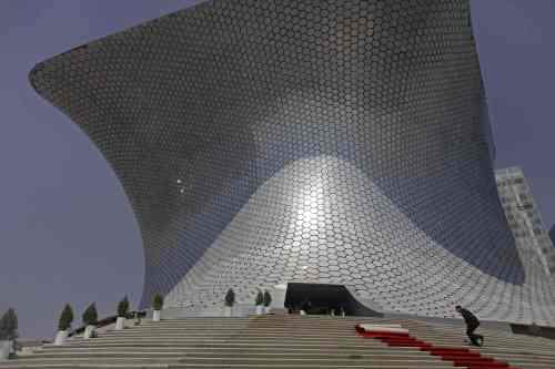 A man runs up the stairs of the Soumaya Museum’s new home in Mexico City on March 1. (AP-Yonhap News)