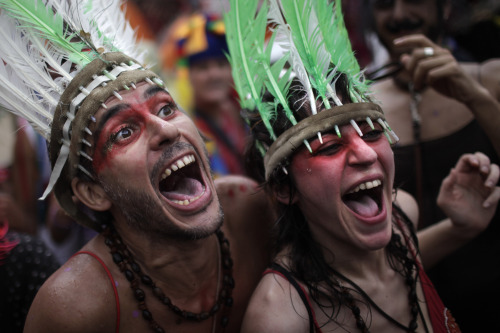 Revelers sing during a 