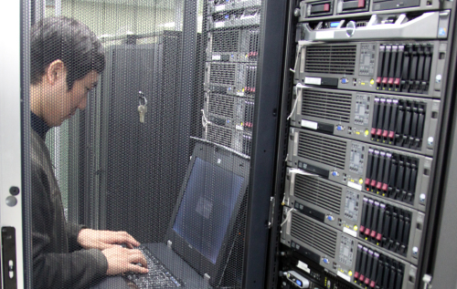 An engineer checks computer systems at a company in Seoul on Sunday. (Yonhap News)