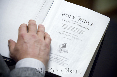 Pastor Chris Huff, of Bible Baptist Church, in Mount Prospect, Illinois, holds his copy of the King James translation of the Bible. (Chicago Tribune/MCT)