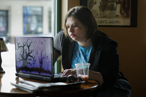 Amanda Hocking works on her laptop at a coffee shop on Austin’s Main Street. (MCT)