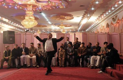 An Afghan man dances during wedding celebrations at a wedding hall in Kabul. (AFP-Yonhap News)