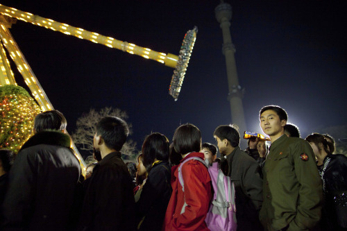 North Koreans form a line for a ride at an amusement park in central Pyongyang, North Korea, Saturday. (AP-Yonhap News)