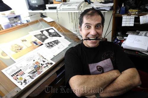 The political cartoonist Jonathan Shapiro, better known as Zapiro, at his home in Cape Town. (AFP-Yonhap News)