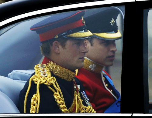Britain's Prince William, right, arrives with his brother and best man, Prince Harry