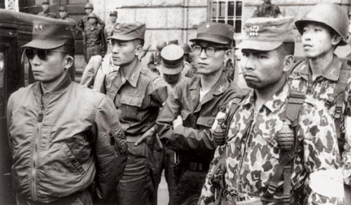 Maj. Gen. Park Chung-hee (left) stands with his lieutenants in front of Seoul City Hall after seizing power in a coup on May 16, 1961. (Korea Herald file photo)
