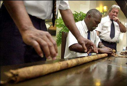 Jose Castelar Cairo has achieved a Guinness World Record for hand-rolling the world's largest cigar, which measured 13.7 meter (45 feet). He's shown here rolling the cigar Nov. 1 in a room of the Melia Cohiba Hotel, in Havana, Cuba. (AP)