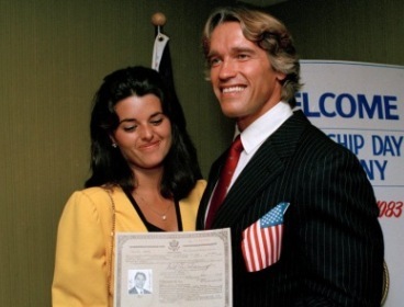 FILE - In this Sept. 16, 1983 file photo, actor and bodybuilder Arnold Schwarzenegger shows off his new U.S. citizenship papers as Maria Shriver, daughter of Sargent and Eunice Shriver, looks on at the Shrine Auditorium in Hollywood, Calif. Schwarzenegger has announced Monday, May 9, 2011 that he and Shriver, his wife of 25 years, are separating. (AP)