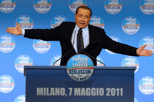 Italian Premier Silvio Berlusconi gestures as he addresses a rally in Milan, Italy, Saturday, May 7, 2011. (AP-Yonhap News)