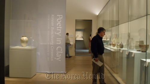 A visitor looks at the “Poetry in Clay: Korean Buncheong Ceramics” exhibition at the Metropolitan Museum of Art in New York on April 27. (Kim Yoon-mi/The Korea Herald)
