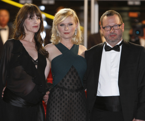 Actresses Charlotte Gainsbourg, Kirsten Dunst and director Lars Von Trier arrive for the screening of Melancholia at the 64th international film festival, in Cannes, southern France. (AP-Yonhap News)