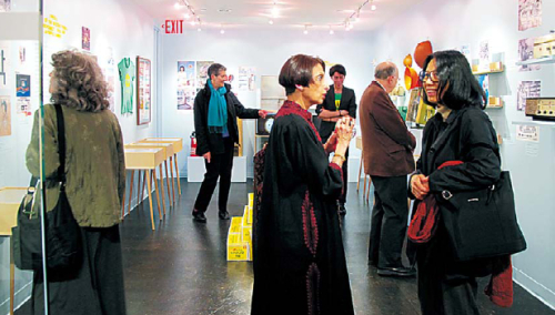 Visitors look around exhibited items at the Korean Society’s “Korea Heritage Design” exhibition in New York.
