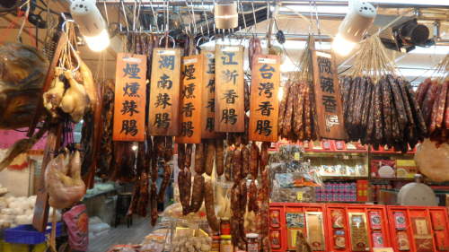 A variety of dried hams and sausages hang from the ceiling at a shop at the Nan Men Market. (Kim Yoon-mi/The Korea Herald)