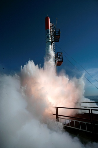 A homemade unmanned 30-foot (9-meter) rocket takes off over the Baltic Sea in Denmark on Friday, June 3, 2011. Two Danish space enthusiasts on Friday successfully launched the homemade rocket. T Peter Madsen and Kristian von Bengtson used a barge near the Danish island of Bornholm as a launch pad for their 1.6 ton rocket, which flew some five miles (eight kilometers) high into the blue sky. (AP)