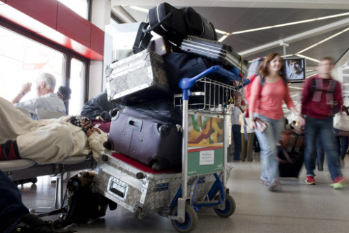A thief hided into a large suitcase inside the luggage compartment of a Spanish airport bus, police say. (AP-Yonhap News)