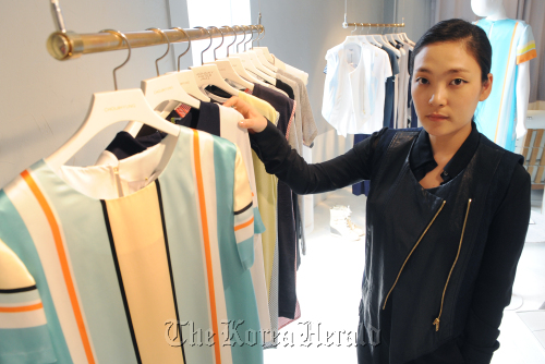 Choi Ji-hyung, chief designer of Johnny Hates Jazz, shows her 2011 S/S collections at the brand’s showroom in Sinsa-dong, southern Seoul. (Lee Sang-sub/The Korea Herald)