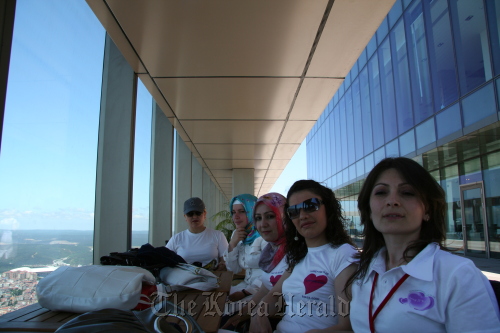 Songdaslarim Turkey Fan Club members pose for a photograph wearing Song Il-gook fan club T-shirts.