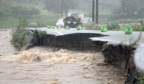 A road collapses after heavy rain hits Wanju, North Jeolla Province. (Yonhap News)