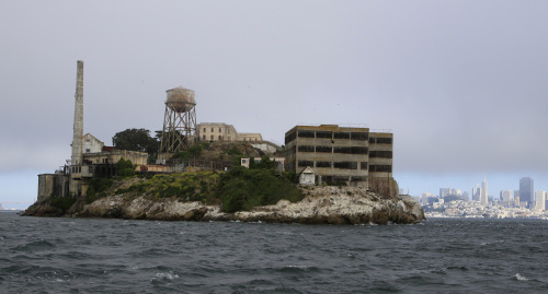 Visitors get a rare view from a tour boat of the west side of Alcatraz Island before taking the night tour of the former prison in San Francisco on July 7. (AP-Yonhap News)