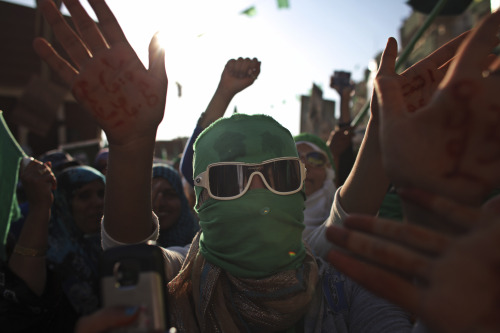 Women take part in a rally in the town of Zlitan, roughly 160 kilometers east of Tripoli, Libya, in this file photo taken on July 15, 2011. Libyan leader Moammar Gadhafi has rejected the decision by the U.S. and other countries to recognize the rebels fighting to oust him, and he vows never to surrender.  (AP)