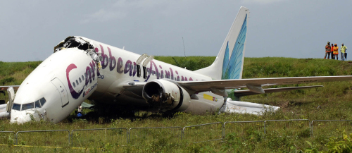 The broken fuselage of a Caribbean Airlines' Boeing 737-800 is seen after it crashed at the end of the runway at Cheddi Jagan International Airport in Timehri, Guyana, Saturday. (AP-Yonhap News)