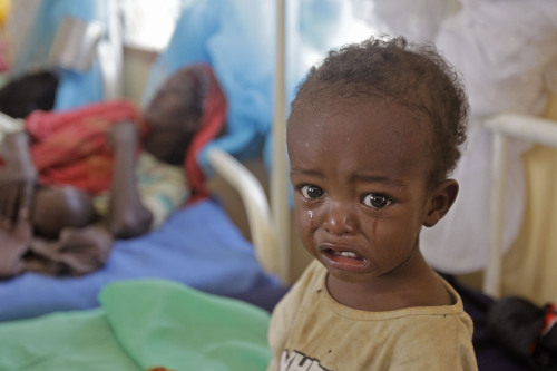 A malnourished child cries at a hospital of the International Rescue Committee in Kenya on Wednesday. (AP-Yonhap News)