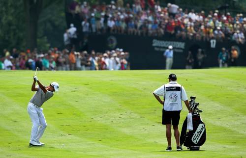 Adam Scott hits an approach shot on the 17th hole during the third round of the Bridgestone Invitational golf tournament at Firestone Country Club in Akron, Ohio, Saturday. (AFP-Yonhap News)