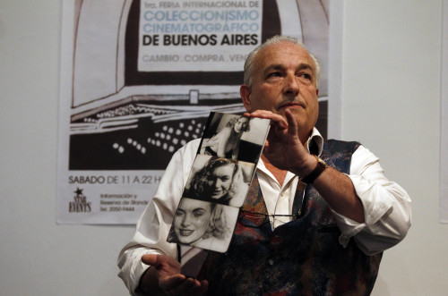 Memorabilia collector Mikel Barsa holds up stills from what he claims is a film showing Marilyn Monroe having sex when still underage during its auction in Buenos Aires, Argentina, Sunday. (AP-Yonhap News)