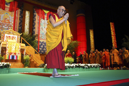 The Dalai Lama greets audience members prior to a session of meditation in France on Saturday. (AP-Yonhap News)