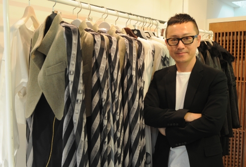 Lee Suk-tae, head designer and founder of the brand KAAL E SUKTAE, poses at the brand’s showroom in Sinsa-dong, southern Seoul. (Lee Sang-sub/The Korea Herald)