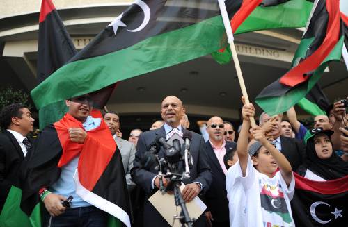 Ambassador Ali Aujali (center) of the Libyan Transitional National Council to the U.S. announces the opening of the new Embassy of Libya in Washington, D.C. on Wednesday. (AFP-Yonhap News)