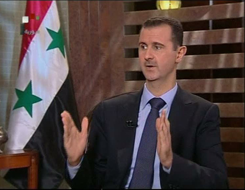 Bashar Assad talks on state TV on Sunday. (AP-Yonhap News)