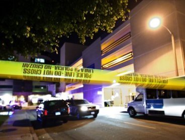 Police lines mark where an unidentified infant boy fell or was thrown from the Children's Hospital of Orange County parking lot on Monday, according to police. (AP)