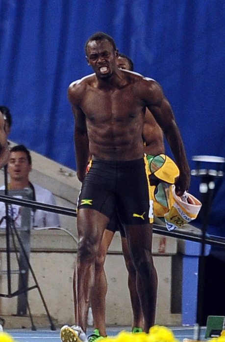 The men’s 100-meter world record holder Usain Bolt tears off his shirt after being disqualified for a false start. (Park Hae-mook/The Korea Herald)
