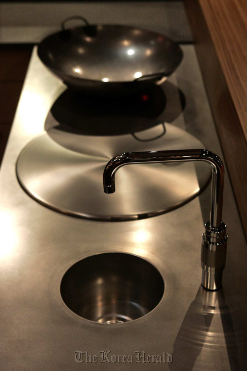 Stainless steel is one alternative to the ever-present granite countertop in a modern kitchen. (Los Angeles Times/MCT)