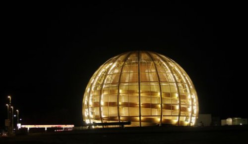 The globe of the European Organization for Nuclear Research, CERN, is illuminated outside Geneva, Switzerland. (AP)