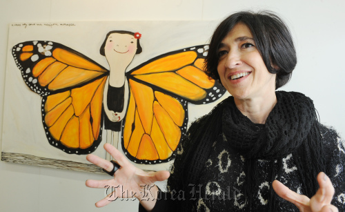 Eva Armisen talks in front of her work “Sometimes I am like a Monarch butterfly” on Friday at KIAF in COEX, southern Seoul. (Park Hyun-koo/The Korea Herald)