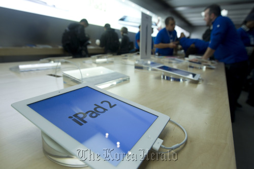 Apple’s iPad 2s sit on display at the flagship retail store in New York. (Bloomberg)